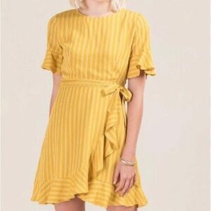 Francesca’s dress. Yellow with a slit and tie